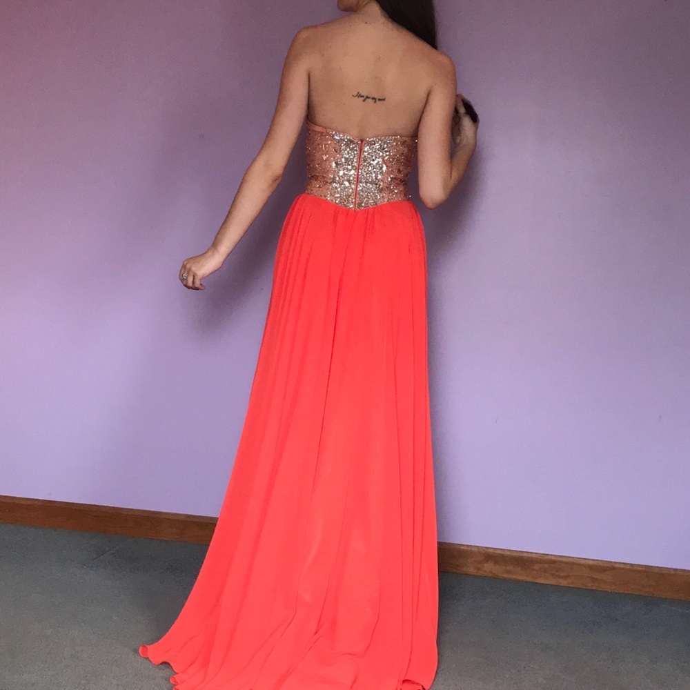 Orange, rhinestone gown with leg slit
